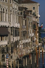 ITALY, Veneto, Venice, The Grand Canal.  Waterside buildings and gondola moorings from the Rialto.