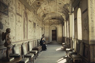 ITALY, Lazio, Rome, Vatican City.  Nuns in waiting room decorated with frescoes by Raphael.