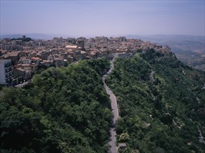 ITALY, Sicily, Enna Province, "A road leading to the city , view West over the rooftops from