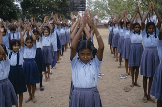 INDIA, Andhra Pradesh, Education, Primary school children starting day with physical exercise.