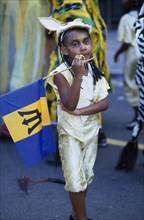 ENGLAND, London, Notting Hill carnival young girl in gold costume.