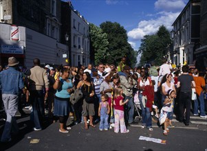 ENGLAND, London, Notting Hill carnival multicultural group of parade onlookers.