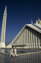 PAKISTAN, Islamabad, "Worshippers walking past the pool at the Shah Faisal mosque.  Part view of