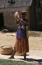 MADAGASCAR, Agriculture, Road to Ranomanfana. Woman wearing a Los Angeles Lakers Basketball team