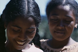 MADAGASCAR, People, Women, Road to Ranomanfana. Portrait of two young women smiling with their eyes