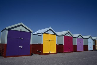 ENGLAND, East Sussex, Hove, Row of colourful beach huts