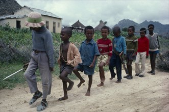 ERITREA, Keren Province , Children pretending to be soldiers marching in line.
