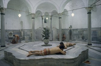 TURKEY, Istanbul, Seraglio Point.  Gagaloew Baths Turkish hamam interior with male bathers.