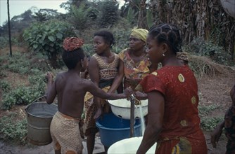 NIGERIA, Midwest State, Women collecting water from stand pipe.