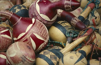 NIGERIA, Market, Decorated calabash shakers for sale at market.