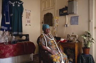 SOUTH AFRICA, Guateng, Johannesburg, Portrait of Zionist uniform maker in home / workshop.