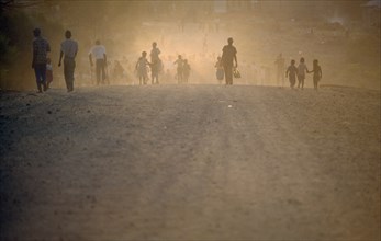 SOUTH AFRICA, Mpumalanga, Matsulu, "Protest march, people seen through dust and haze."