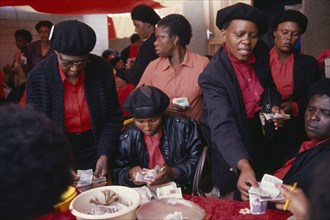 SOUTH AFRICA, Gauteng, Alexandra Township, "Female members of Burial Society or Stokvel counting
