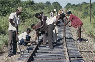 CONGO, Shaba Province, Men working on railway tracks.