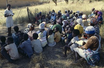 ZIMBABWE, People, Family Planning Association education officer and distributor talking to women on