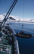 ANTARCTICA, Transport, Lowering Zodiac inflatable boats from a ship for taking passengers ashore
