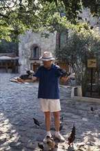 TURKEY, Bodrum, Dr George Bass founder of Nautical Archaeology Institute with his arms stretched