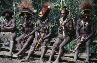 PACIFIC ISLANDS, Melanesia, Papua New Guinea, Southern Highlands. Huli tribe men sat together