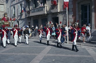 FRANCE, Provence Cote D Azur, Var, Saint Tropez. Bravade Festival with men in costume marching in a
