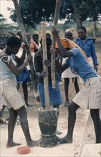 ANGOLA, People, Village women pounding cassava.