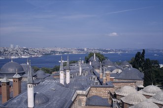TURKEY, Istanbul, Topkapi Palace.  View across rooftops of the Harem to the Bosphorous.