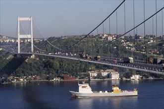 TURKEY, Istanbul, Faith Bridge from the European side with ship passing below. Bosphorus Bridge