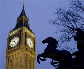 ENGLAND, London, Westminster.Big Ben Clock Tower and the statue of Boudicea in silhouette in the