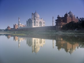 INDIA, Utter Pradesh, Agra, The Taj Mahal seen from across the Yamuna River with its reflection