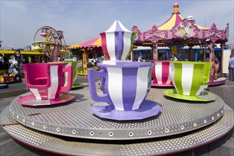 ENGLAND, Dorset, Bournemouth, Funfair ride of teapot and teacups on Bournemouth Pier