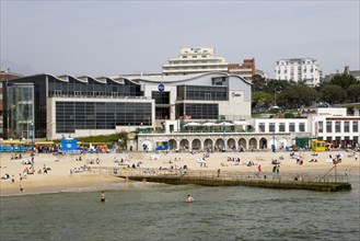 ENGLAND, Dorset, Bournemouth, The Imax Complex on the seafront with people on the beach and in the