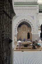 MOROCCO, Mosque, Men washing before entering mosque.