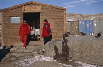 ANTARCTICA, Ross Sea, Terra Nova Bay, Men in red jackets outside a coffee shop at station of
