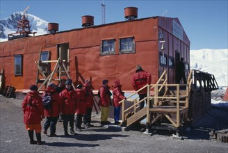 ANTARCTICA, Waterboat Point, Tourists wearing red jackets visiting Chilean station Gonzalez Videla