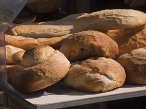FRANCE, Deux Sevres Region, Poitiers, Different shaped bread on sale at a market stall in the town