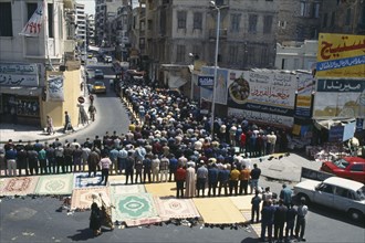 EGYPT, Nile Delta, Alexandria, Crowds attend Friday prayers in the street.