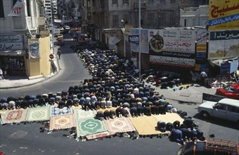 EGYPT, Nile Delta, Alexandria, Crowds attend Friday prayers in the street.
