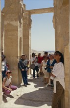 EGYPT, Nile Valley, Luxor, Tourist group visiting archaeological site.