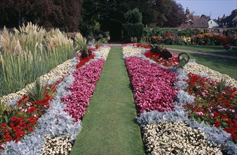 ENGLAND, East Sussex, Lewes, Southover Grange Gardens. Colourful formal flower bed displays