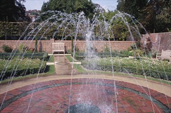 ENGLAND, East Sussex, Lewes, Southover Grange Gardens. Walled garden with central water fountain