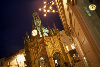 ENGLAND, West Sussex, Chichester, Angled view of The Cross at night  with star shaped Christmas