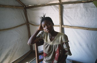 GUINEA, Kissidougou Camp, Portrait of woman in refugee camp for Sierra Leonean  refugees suffering