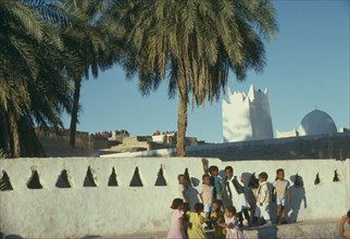 LIBYA, Great Eastern Erg, Ghadamis, Children playing on walls of the citadel.