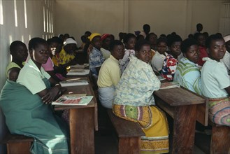 MALAWI, Kunyinda Camp, Mozambican refugee women attending adult literacy class. Young woman in