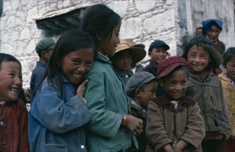 TIBET, Lhasa, Group of smiling children.