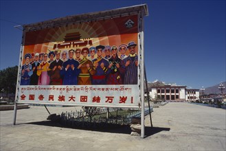 TIBET, Lhasa, Propaganda poster marking 40th anniversary of the ‘Peaceful Liberation’ of Tibet.