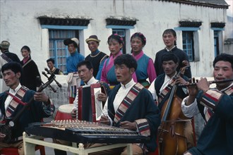 TIBET, People, Village orchestra and dancers in traditional dress.