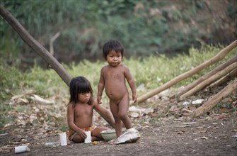 PANAMA, Children, Two Embera Indian children playing with plastic cups and bowls