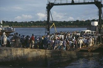 KENYA, Mombasa, Crowds boarding the Likoni ferry.