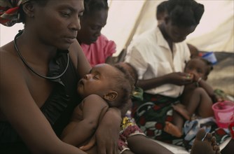 ZAMBIA, Mayukwayukwa Camp, Mothers and babies in feeding centre for malnourished children in camp