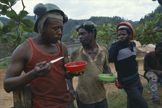 JAMAICA, Portland, Bauxite miners on lunch break.